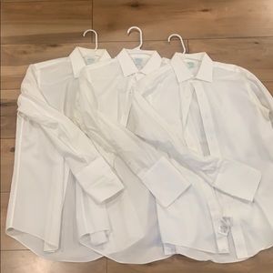 Three white Brooks Brothers dress shirts